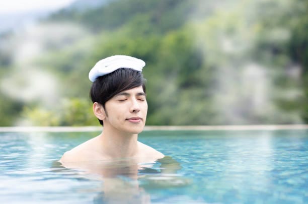young man relaxing in hot springs